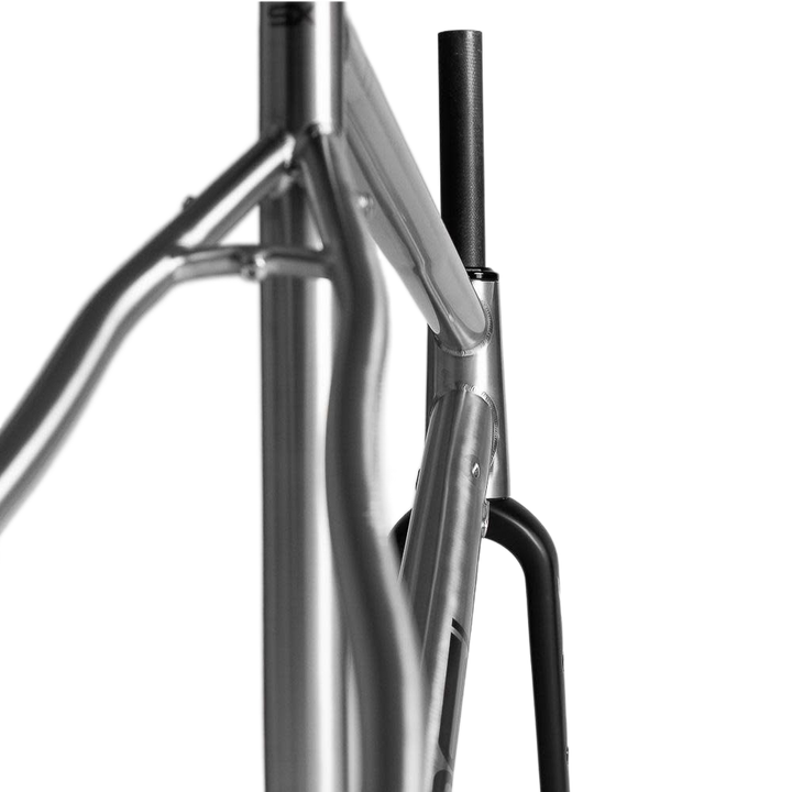 Focused image of the silver frameset of 2023 BOSSI bike